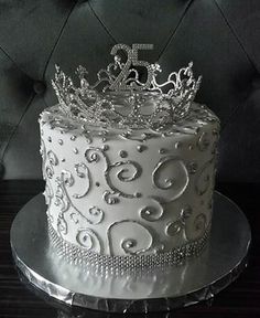 a white cake with a silver crown on top