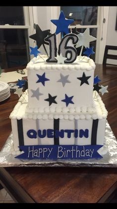 a white and blue birthday cake with stars on it