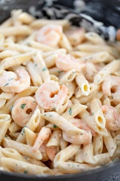 pasta with shrimp and parsley in a skillet