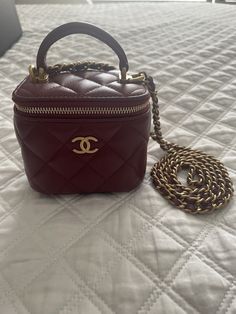 Hi, I am selling a pre-owned Chanel small vanity clutch with a chain strap. The vanity is in excellent used condition, there are hardly any signs of use; no stains or tears. The vanity bag will come with the original box, dust bag, care cards, tag, and authenticity card. The vanity is from 21A season. AP2198B05810NC635. It measures about 3.5” x 4” x 2.75”. The chain strap has a 22” drop. 100% authentic Chanel. All sales are final and no returns will be accepted. Chanel Vanity Bag, Chanel Vanity, Small Vanity, Chain Handbag, Vanity Bag, Bag Chain, Chain Shoulder Bag, Quilted Leather, Chain Strap