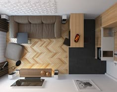 an overhead view of a living room with wood paneling on the walls and floor