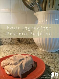 a red plate topped with whipped cream on top of a counter