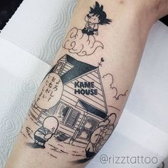 a person with a tattoo on their arm that says kime mouse in front of a house