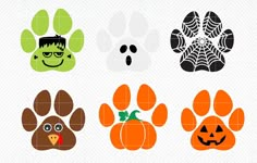 four halloween paw prints with pumpkins, spider web, and dog's face