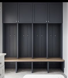 a row of lockers sitting next to each other in a bathroom