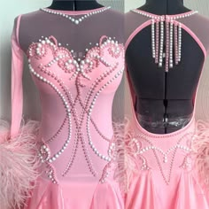 a pink ballet dress with feathers and beads on the bottom, in front of a mannequin