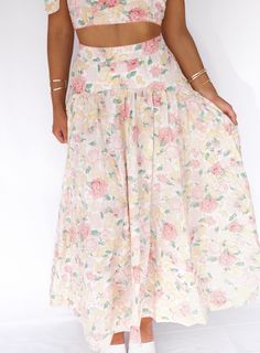 Introducing our Lush Garden Midi Skirt - the ultimate two-in-one outfit for any occasion. With its charming floral skirt and coordinating tie tank, you'll be ready for a bridal shower or fancy tea party in no time. Perfect for those who enjoy the sweeter things in life! Fabric 100% Rayon Floral Print Summer Maxi Skirt For Day Out, Feminine Flowy Maxi Skirt For Vacation, Feminine Long Skirt For Vacation, Spring Floral Print Maxi Skirt, Floral Print Long Maxi Skirt For Spring, Summer Style Gathered Maxi Skirt, Feminine Relaxed Maxi Skirt For Vacation, Casual Tiered Maxi Skirt For Garden Party, Chic Tiered Skirt For Garden Party