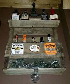 an old wooden box filled with bottles and liquor