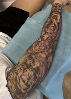 a man's arm with tattoos on it