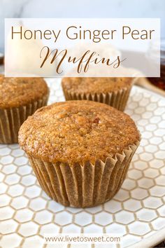 three muffins sitting on top of a white plate with the words honey ginger pear muffins