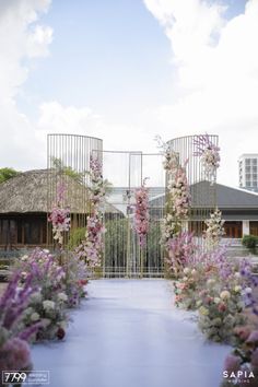 an outdoor wedding ceremony with flowers in the foreground