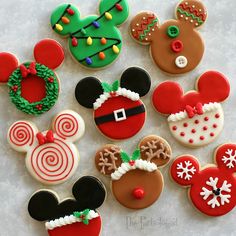 some decorated cookies are sitting on a table