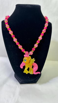 This Beautiful Character Necklace is a perfect gift for any Child or Adult alike.  ⭐️We use High Quality Stretchy Cord & Beads that connects with the Beaded Tube and cover by a Crimp Bead . This Beautiful Necklace can be stretched enough to put over your little one's head.  ☀️If you would like a Toggle or Lobster Clasp we can do it at no extra charge we would use High Quality String Bead Wire which won't be stretchy. Just add it to the Notes!  🌳If no note it will have the Stretchy Cord when you My Little Pony Bracelets, My Little Pony Jewelry, My Little Pony Keychain, My Little Pony Bag, My Little Pony Necklace, Bug Juice, Pony Birthday, Strung Beads, Crimp Beads