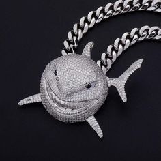 This Shark Pendant is inspired by Rapper 6ix9ine Shark Chain seen in his Music Video "GOOBA". Need the bigger size? Shop 6ix9ine's XXL Shark Chain. White Gold Plated: 5x PVD Plating & VVS CZ Stones PREMIUM Quality: Hand Set Diamonds No form of discomfort on your skin Free Chain included Size: Lenght: 60mm / 2.36 inch | Width: 30mm / 1.18 inch | Weight: 16g FREE STANDARD SHIPPING 6ix9ine Chain, Shark Chain, Shark Pendant, Cuban Chain, Buy 1 Get 1, Gold Plated Chains, Cz Stone, Rope Chain, Buy 1