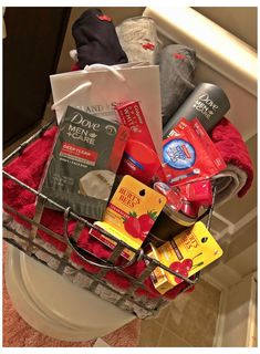 a basket filled with items sitting on top of a toilet