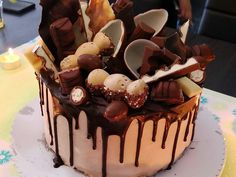 a cake with chocolate icing and candies on top