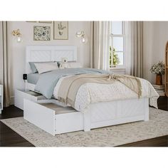 a white bed with two drawers underneath it