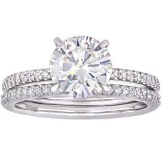 a diamond engagement ring set with two matching bands