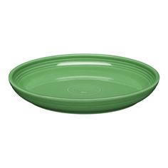 an empty green plate on a white background