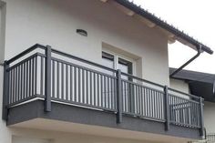 an apartment building with a balcony and balconies