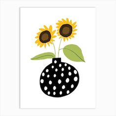 a black and white polka dot vase with sunflowers