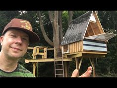 a man standing in front of a tree house