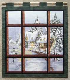 a window view of a snowy winter scene