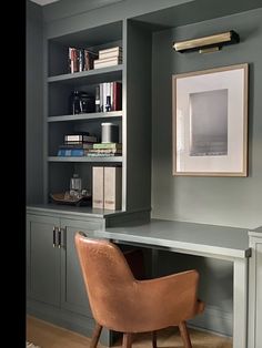 a chair sitting in front of a book shelf