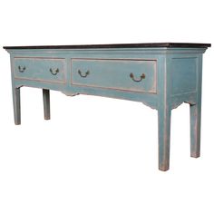 an old blue dresser with two drawers on one side and a drawer on the other