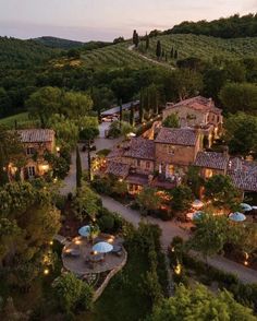 an aerial view of the estate at dusk, with umbrellas and tables in the foreground