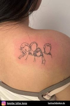 the back of a woman's shoulder with an outline of two people on it