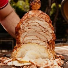 a large piece of meat sitting on top of a cutting board