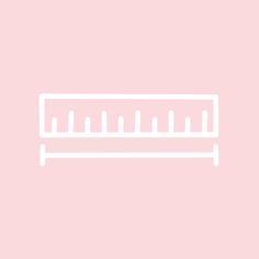 a white line drawing of a ruler on a pink background