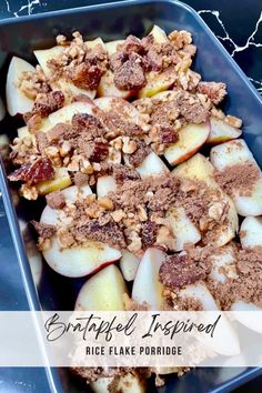 a blue dish filled with apple slices and walnut crumbled toppings on top