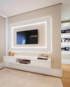 a living room with a large flat screen tv mounted to the side of a wall