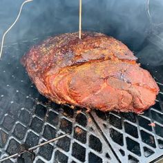 a steak is being cooked on the grill