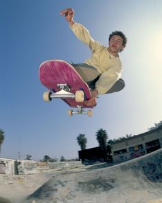 a man flying through the air while riding a skateboard