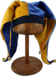 a wooden stand with a blue and yellow hat on it