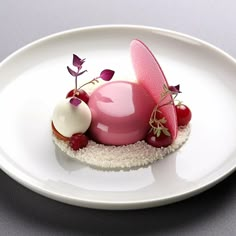 a plate that has some kind of dessert on it with berries and other food items