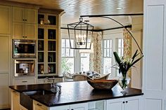 a large kitchen with an island in the middle