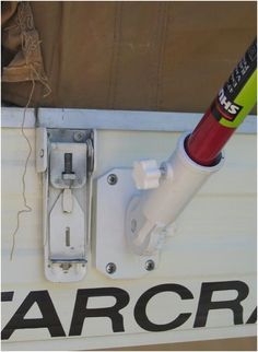 a close up of a baseball bat on the back of a boat