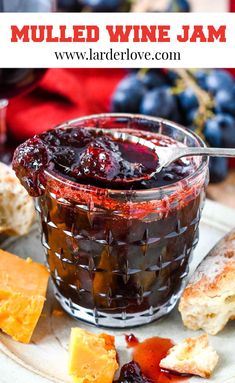 mulled wine jam in a glass with bread and grapes on the side