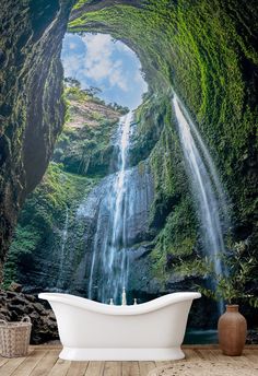 A white freestanding bathtub is positioned in front of a large Decor2Go Wallpaper Mural flowing down a lush Waterfall Wall Mural, Waterfall Mural, Wallpaper Waterfall, Waterfall Decoration, Tropical Backdrop, Streams Of Water, Yard Makeover, Bathroom Mural, Custom Water Feature