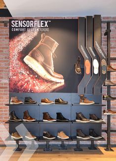 there are many shoes on display in the store