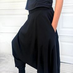 "Black Samurai Style Ninja Pants for Women and Men. This Stretch Cotton Harem Pants Fit Plus Size. -Unisex -Stretch -Flowing relaxed fit -Inner drawstring to secure the waist -2 side pockets Great for Yoga, Dance, Exercises, Meditations, Yoga Practice and beyond... Materials: black color cotton blend (90% cotton 10% lycra). Fabric for this pair were bought in Fashion District, LA and the pant was made in one of the studios in Los Angeles, CA. Measurements: Fits: S, M, M/L -Length: 41\" (~102 cm) Casual Harem Bottoms With Side Pockets, Black Hip-length Bottoms For Yoga, High-waist Loose Fit Harem Pants With Side Pockets, Black Wide Leg Harem Pants For Loungewear, Non-stretch Black Pants With Wide Waistband, Black Non-stretch Pants With Wide Waistband, Black Fitted Drop Crotch Bottoms, Stretch Black Harem Pants For Loungewear, Black Stretch Harem Pants For Loungewear