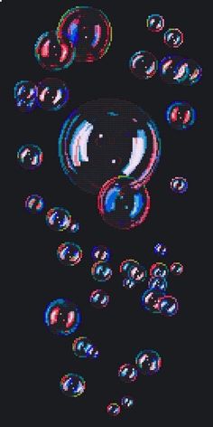 some bubbles are floating in the air on a black background with an image of a smiley face