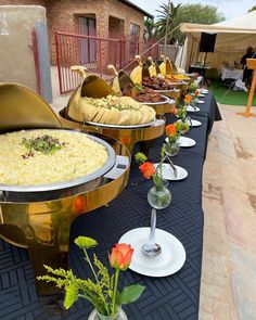 there are many different types of food on the table at this outdoor event that is ready to be eaten