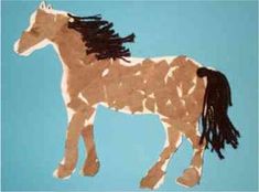 a paper cut out of a horse with long manes on it's tail