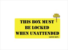 a yellow sign that says this box must be locked when unattended safety dept