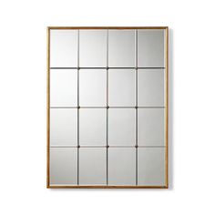 a mirror that is on the wall with some squares in it and one side missing